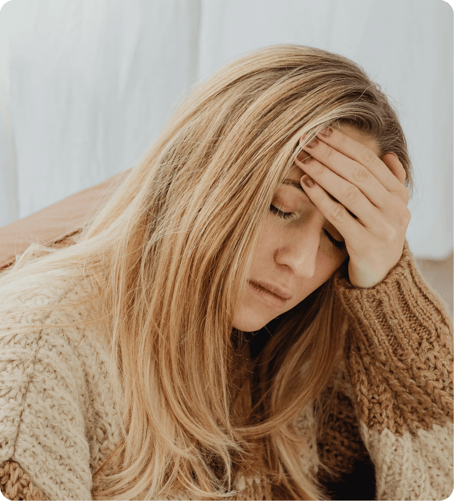 Woman with headache, stressed.