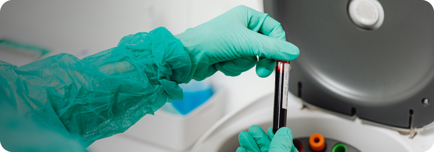 Doctor holding tube of blood